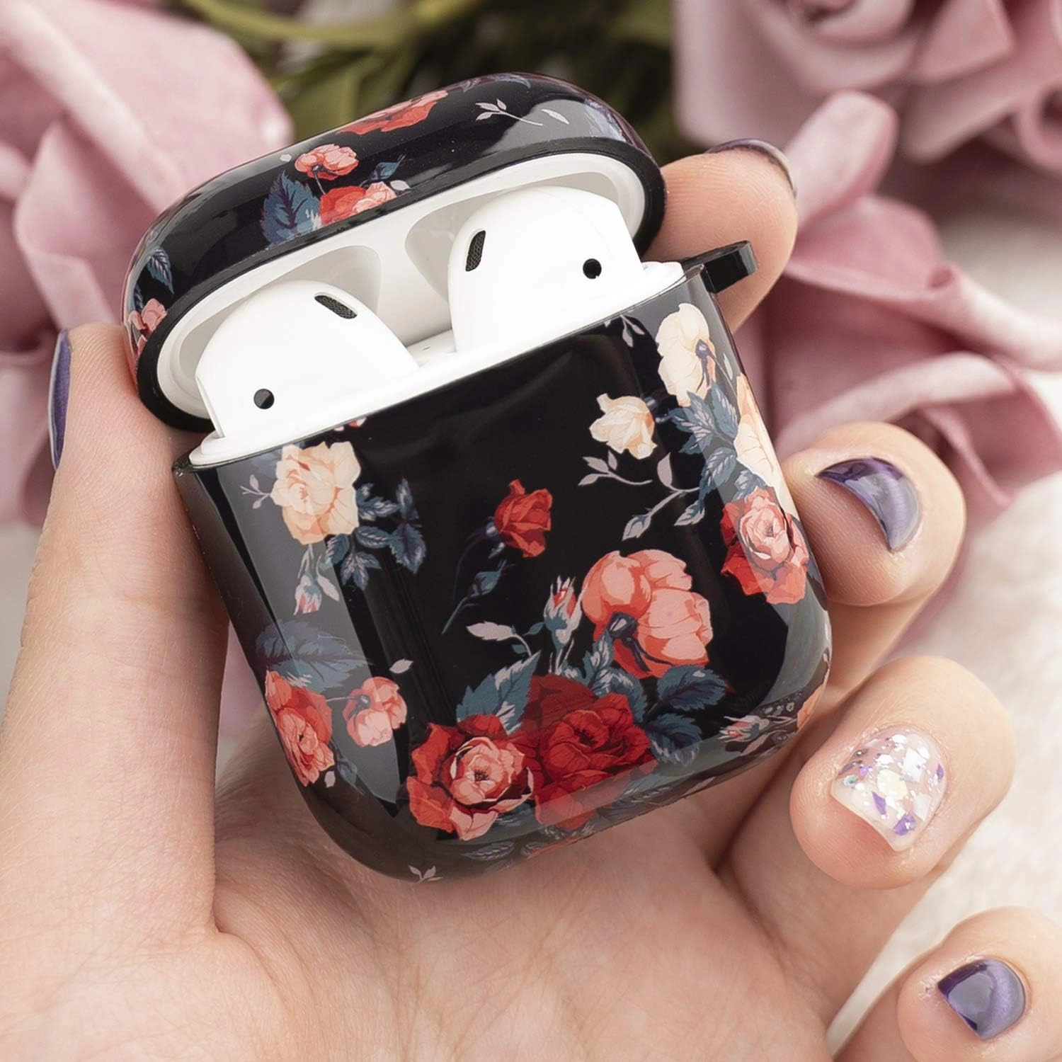 Flower print AirPods 1st/2nd Gen protective hard case on a charging case